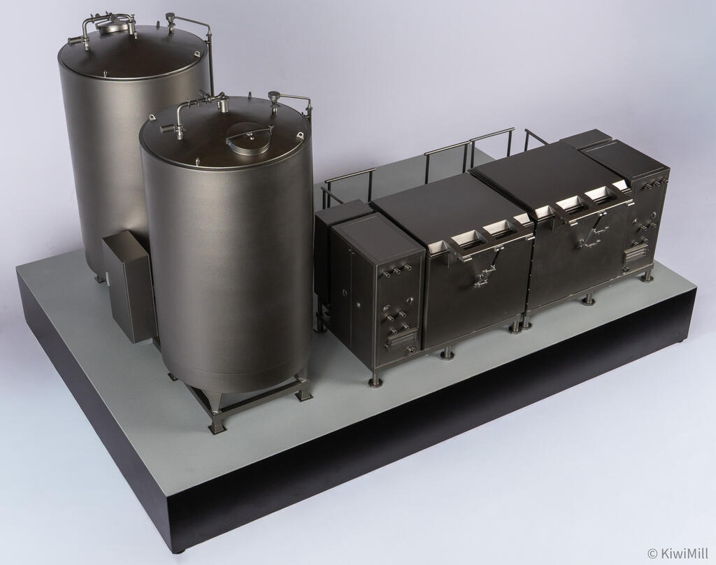 Overhead rear view of the full layout, two tank lids and piping beside the cook tank's hinged lids and handrails